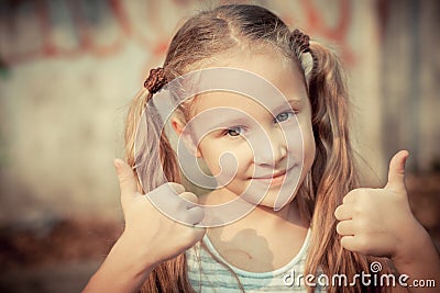 Happy girl shows gesture cool Stock Photo