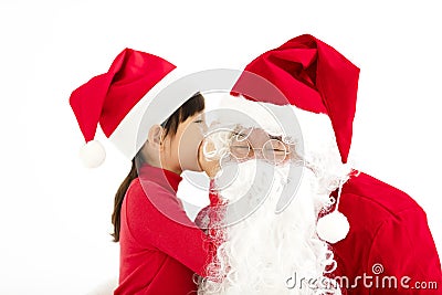 Happy Girl telling wish in Santa Claus`s ear Stock Photo