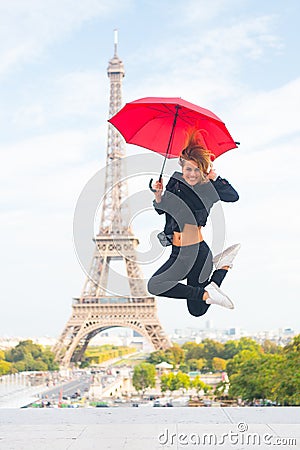 Happy girl travel in paris, france. Woman jump with fashion umbrella. Parisian on white background. Woman with Stock Photo