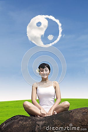 Happy girl under ying yang cloud outdoor Stock Photo