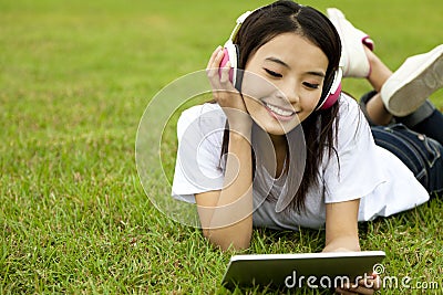 Happy girl using tablet pc Stock Photo