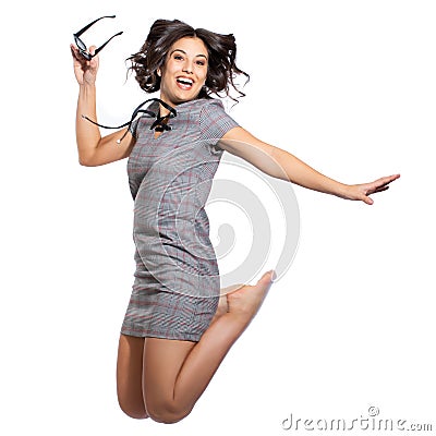 Happy girl in vintage check dress jumping Stock Photo