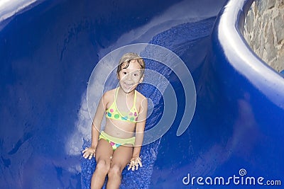 Happy girl on waterslide Stock Photo