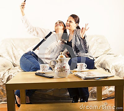 Happy girlfriends taking a selfie Stock Photo