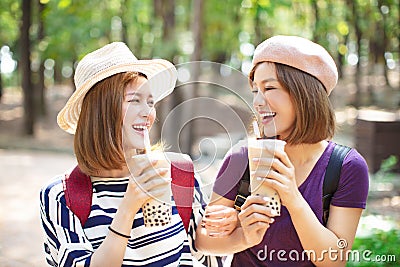 girls drinking bubble tea and enjoy summer vacation Stock Photo