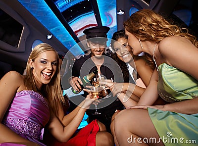 Happy girls having fun in limo Stock Photo