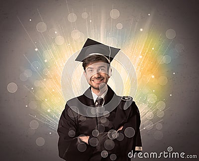 Happy graduate with colorful bokeg lights in the background Stock Photo