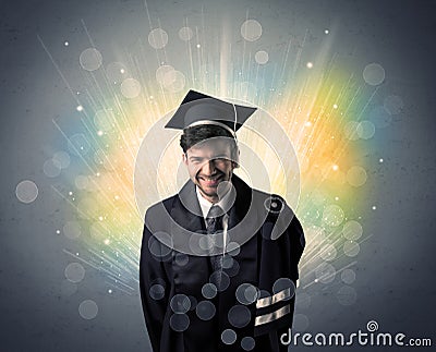 Happy graduate with colorful bokeg lights in the background Stock Photo