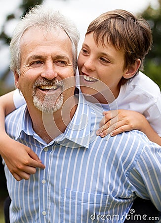 Happy grandfather, child and piggyback outdoor for fun, fathers day and bonding with love, care and smile. Senior man Stock Photo