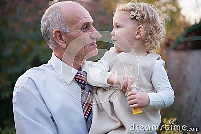 Happy grandfather with granddaughter Stock Photo