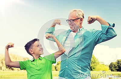 Happy grandfather and grandson showing muscles Stock Photo