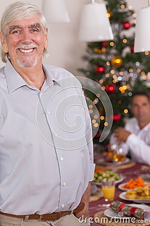 Happy grandfather standing at christmas Stock Photo