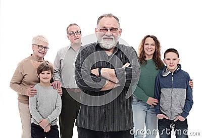 happy grandfather standing in front of his family. Stock Photo