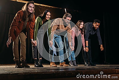 Happy group actors and actresses bowing Stock Photo