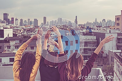 Happy group of asia girl friends enjoy and arm up relax pose at Stock Photo