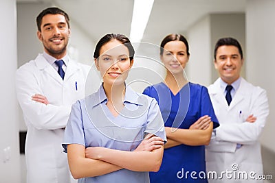 Happy group of medics or doctors at hospital Stock Photo