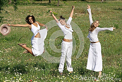 Happy group of teens or youth jumping Stock Photo