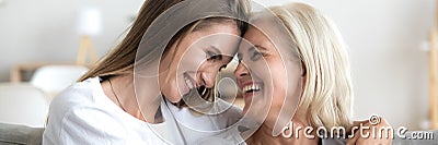 Happy grown up daughter hug senior excited mother horizontal photo Stock Photo