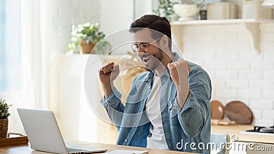 Happy guy celebrate great news opportunity got read by e-mail Stock Photo