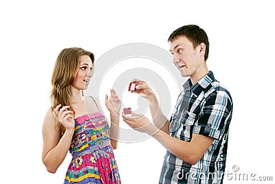 Happy guy makes a girl a gift Stock Photo