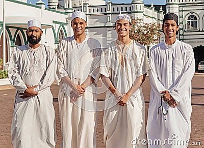 Happy, hajj and Muslim men at a mosque to pray, ramadan faith and group in Mekka together. Smile, religion and portrait Stock Photo