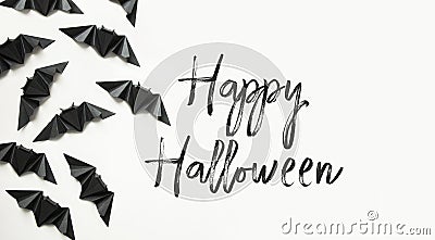Happy Halloween composition. black paper bats on white background Stock Photo