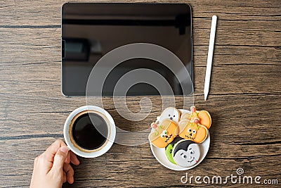 Happy Halloween day with Cookie, coffee and tablet. online shopping, Hello October, fall autumn, Festive, party and holiday Stock Photo