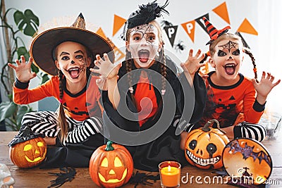 Happy Halloween! a group of children in suits and with pumpkins Stock Photo