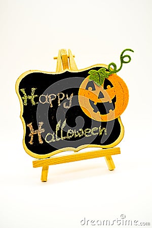 Happy Halloween message write on a blackboard with pumpkin. Isolated on white background. Stock Photo