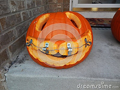 Happy Halloween pumpkin with Braces Stock Photo