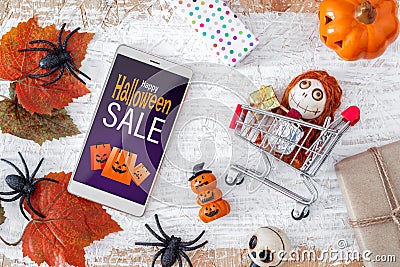 Happy Halloween Sale shopping online promotion offer background concept, smartphone mockup banner flat lay design Stock Photo