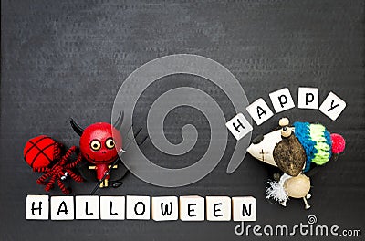 Happy Halloween sign with Happy red devil and red wool spider with wooden dog doll on black background Stock Photo