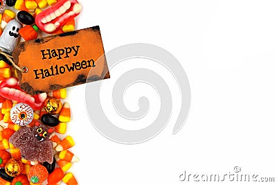 Happy Halloween tag with candy side border over white Stock Photo