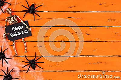 Happy Halloween tag with spider web side border on orange wood Stock Photo