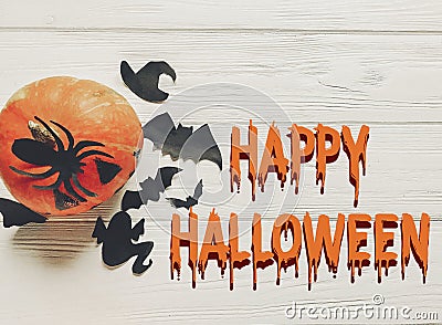 Happy halloween text flat lay. jack lantern pumpkin with witch g Stock Photo