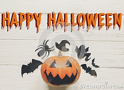 Happy halloween text flat lay. jack lantern pumpkin with witch g Stock Photo