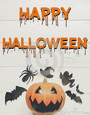 Happy halloween text flat lay. jack lantern pumpkin with witch g Stock Photo