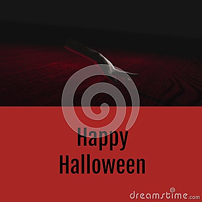 Happy halloween text on red with ghostly severed caucasian hand walking on dark background Stock Photo