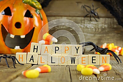 Happy Halloween wooden blocks with candy corn and decor Stock Photo