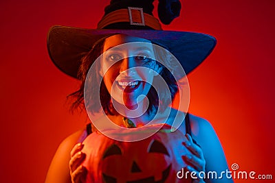 Young woman in black witch costume Stock Photo