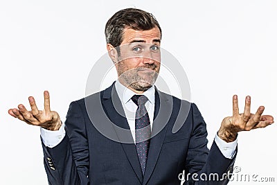 Happy handsome business man showing hands up for carefree success Stock Photo