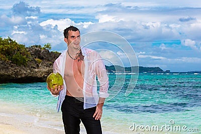 Happy handsome young male wearing in white shirt is standing on Stock Photo