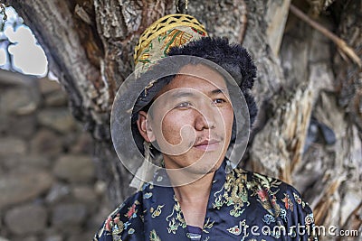 Happy and hansome young man in tradtional dress Stock Photo