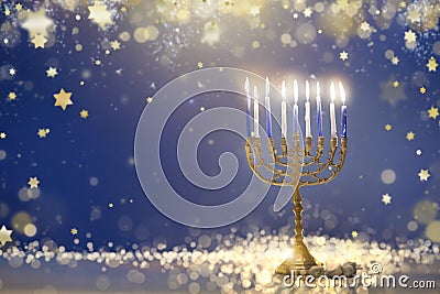 Happy Hanukkah. Candles lit in menorah Stock Photo