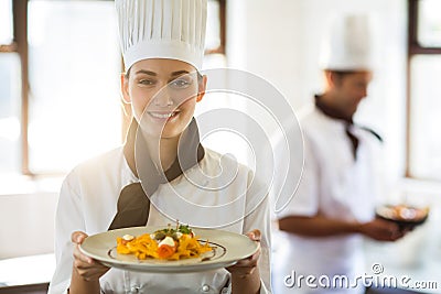 Happy head chef presenting her food Stock Photo