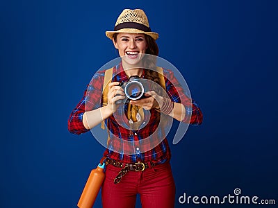 Happy healthy traveller woman with modern DSLR camera Stock Photo