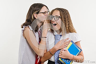 Happy high school friends are teenage girls, talk and secret. Stock Photo