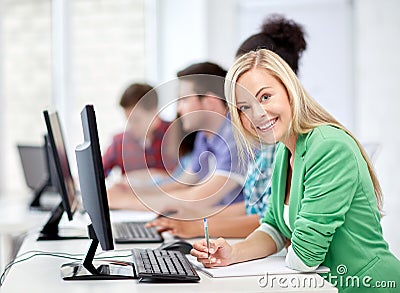 Happy high school students in computer class Stock Photo