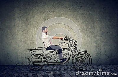 Happy hipster business man riding a motocycle Stock Photo