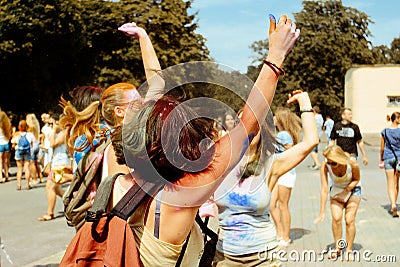 Happy hipster girls having fun with colorful powder at holi fest Editorial Stock Photo
